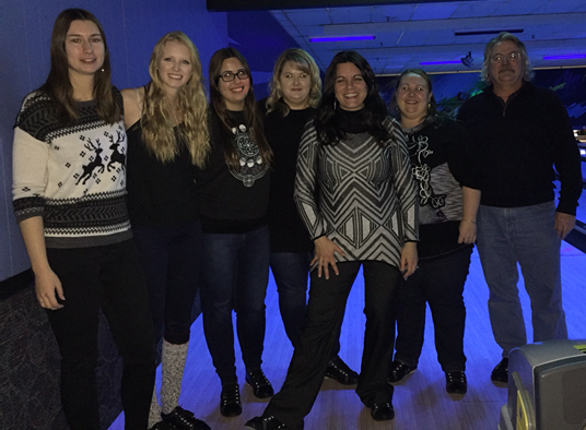 Group photograph at bowling alley. From left: Sarah McCrackin, Anna Hudson, Karla Murtescu, Tracy Duncan, Dr. Roxane Itier, Karisa Parkington, and Frank Preston.