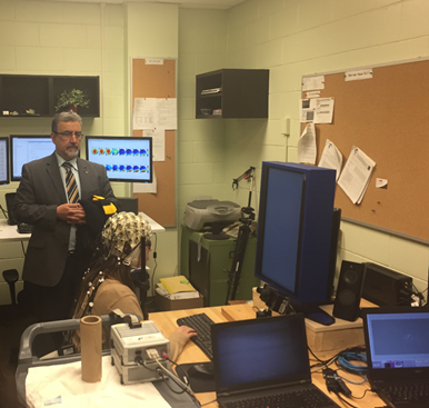 President Hamdullahpur observes as Karla Murtescu completes an EEG and eye-tracking study demonstration.