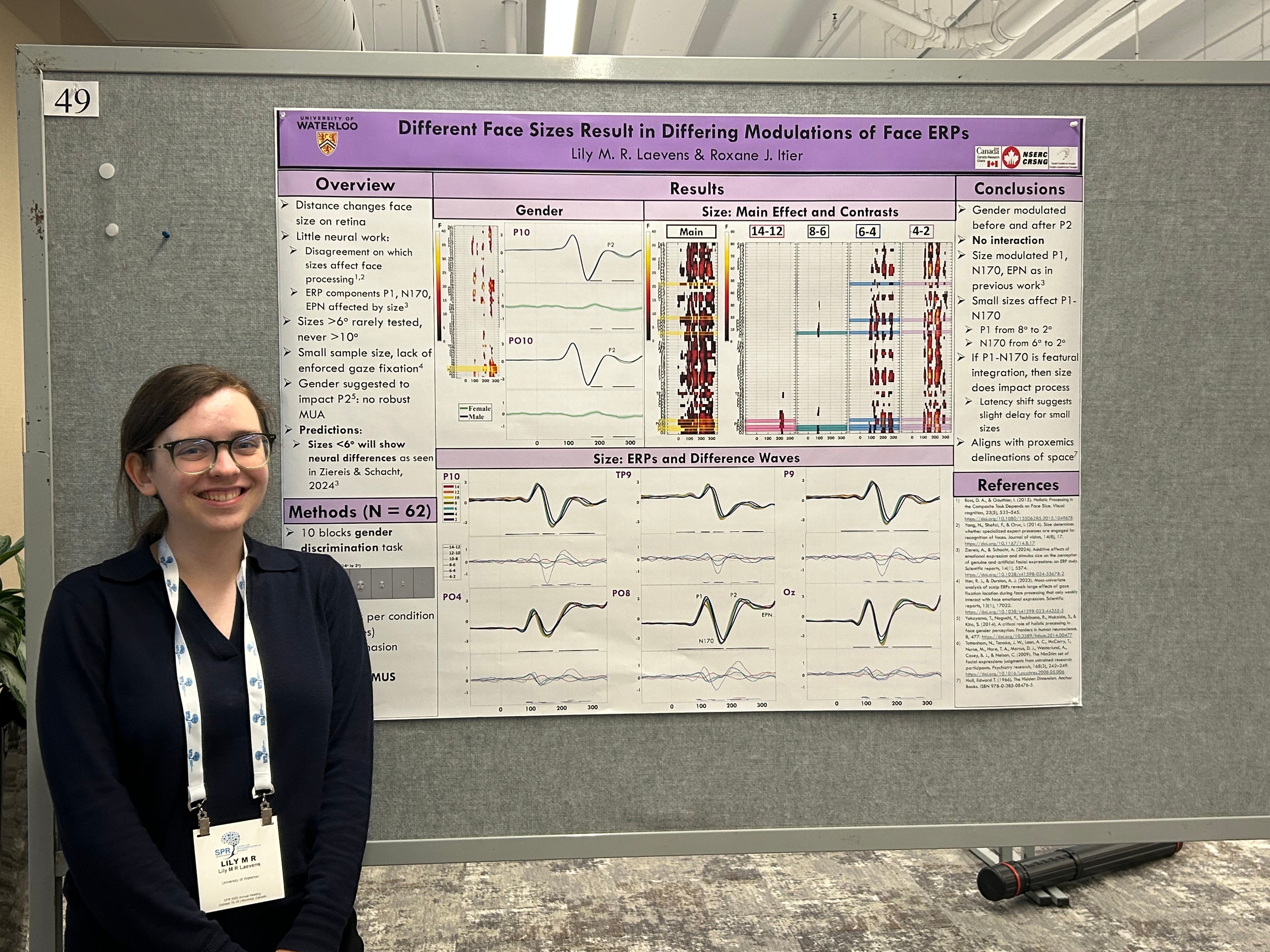 Lily standing at her poster