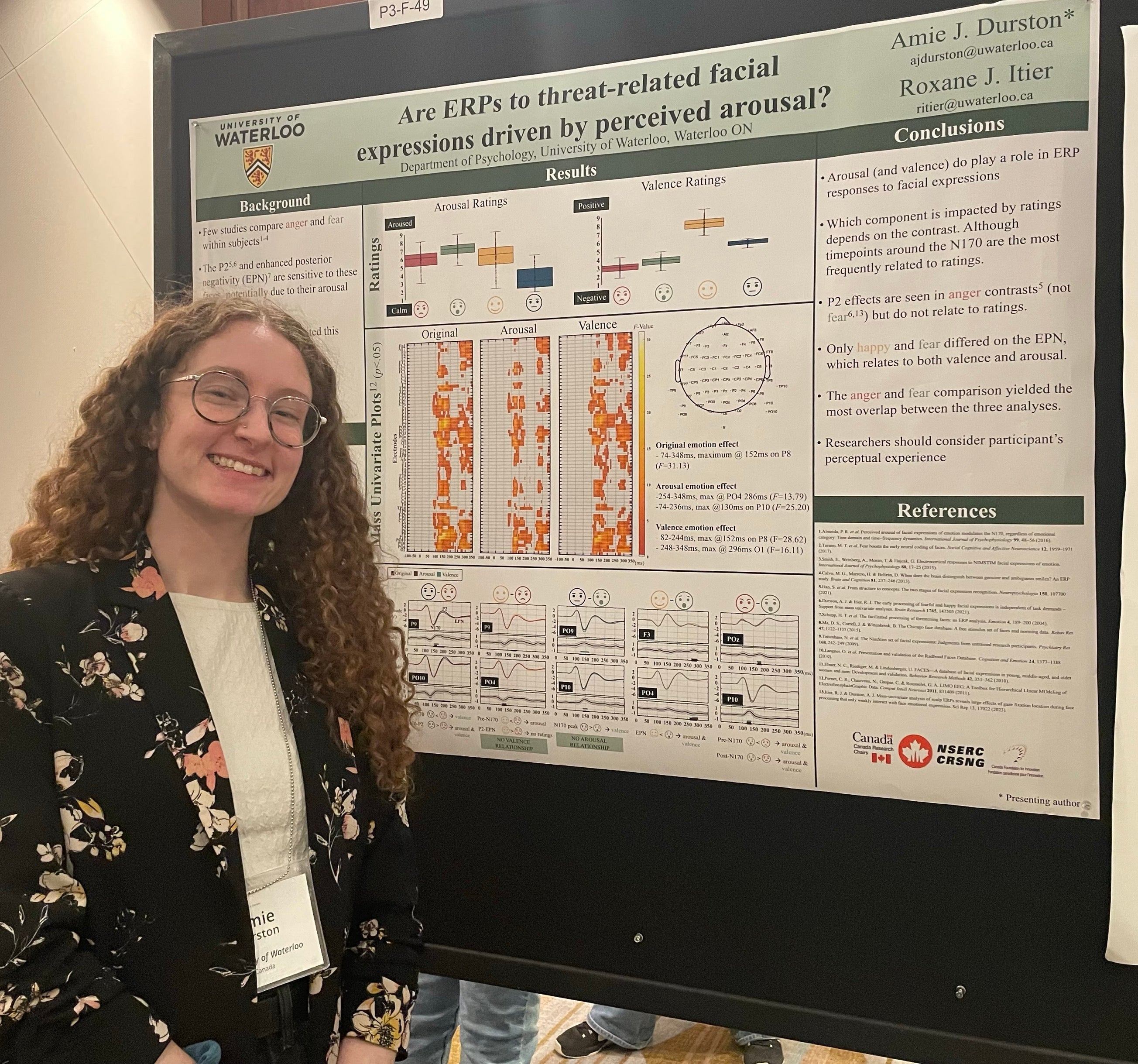 Amie standing next to her poster at SANS