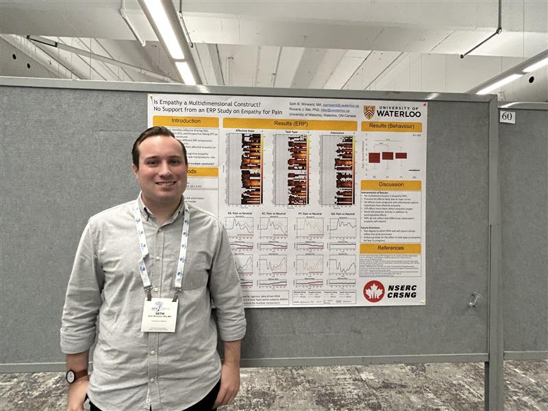 Seth standing at his poster