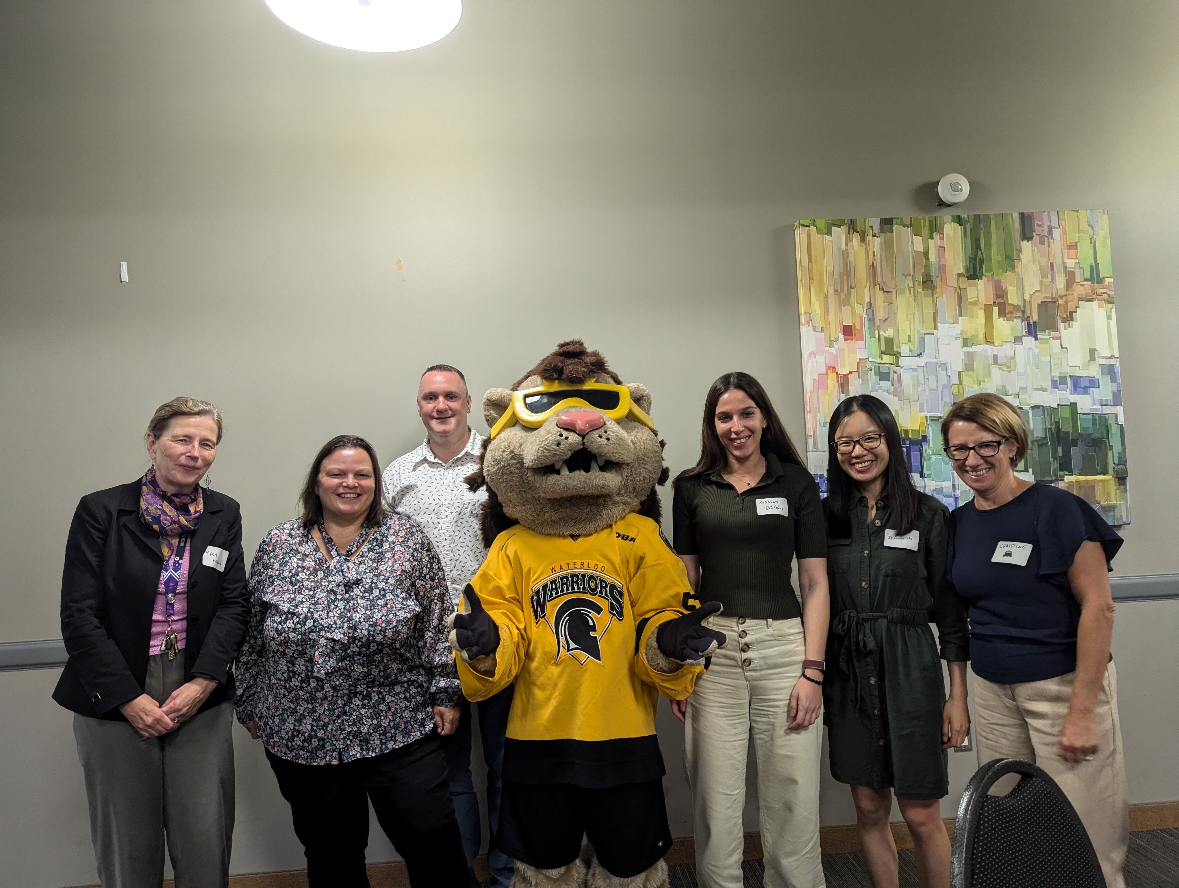 group of people with mascot