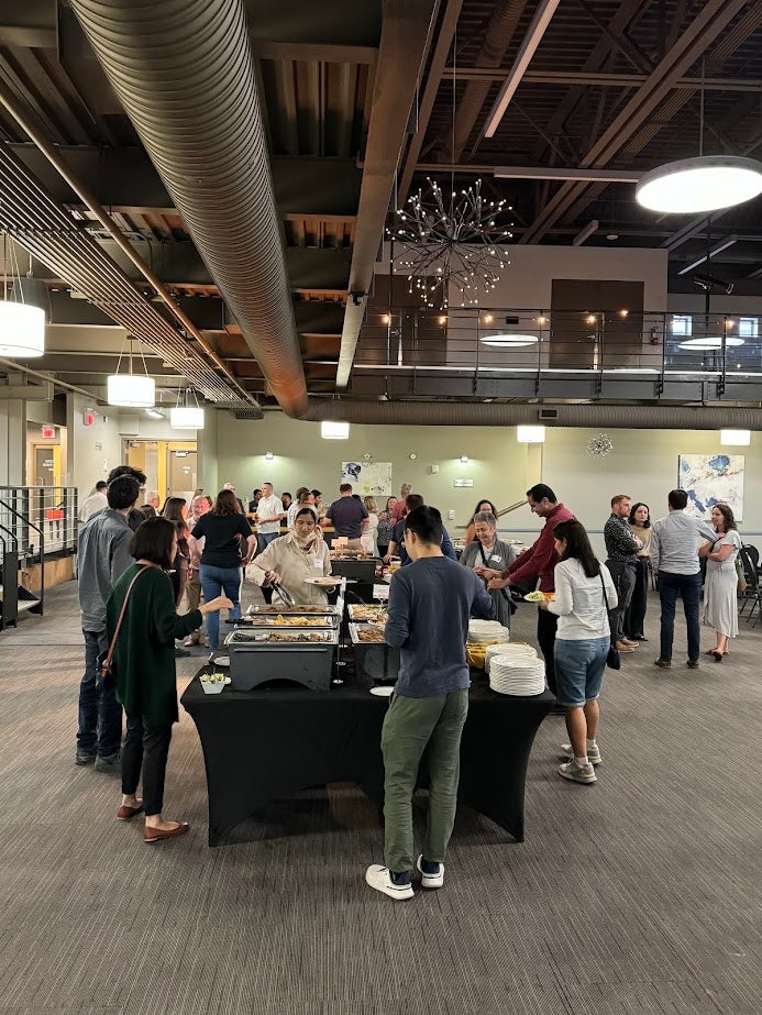 group of people grabbing food