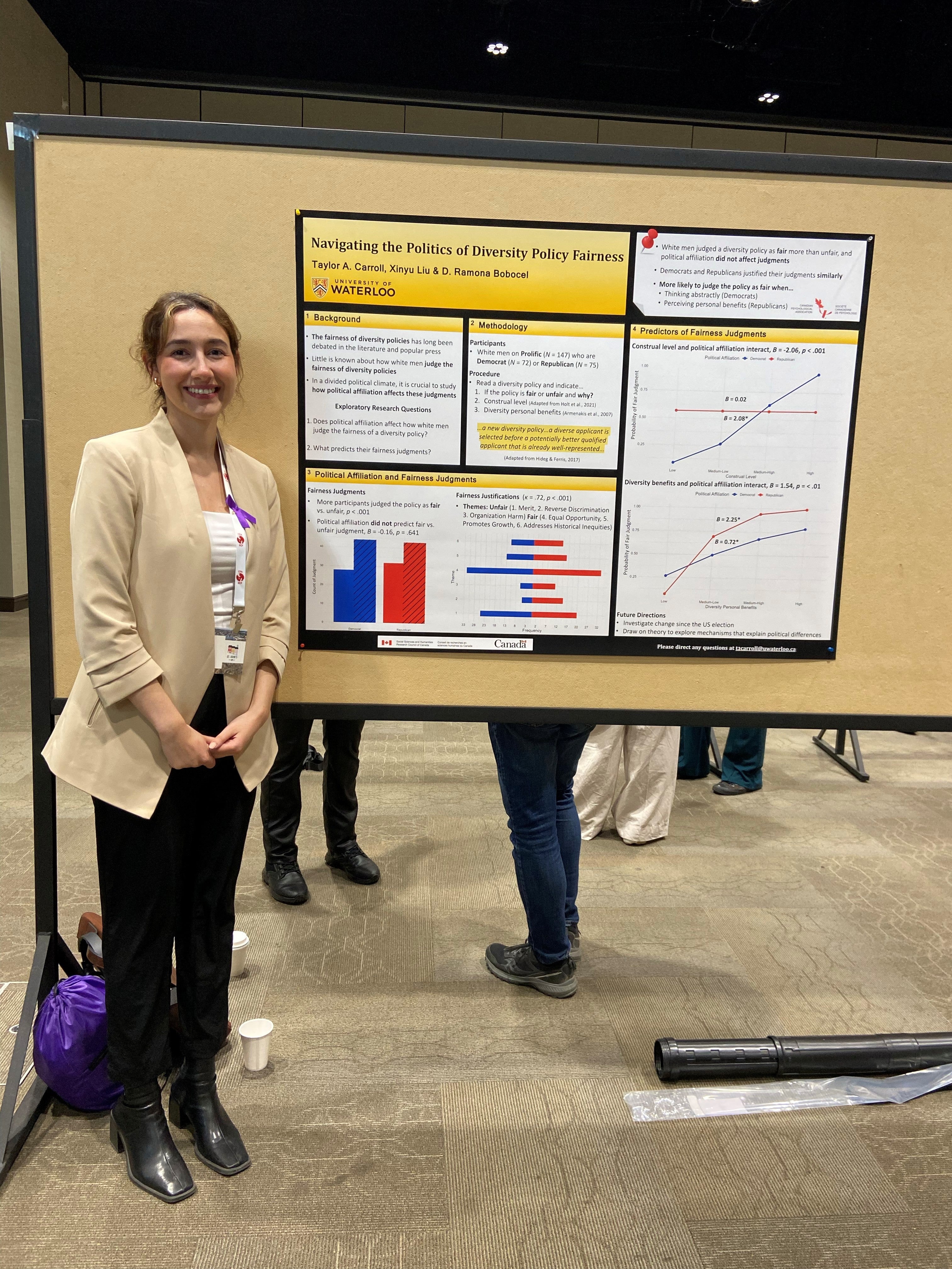 Taylor standing beside her poster at CPA Conference 2025