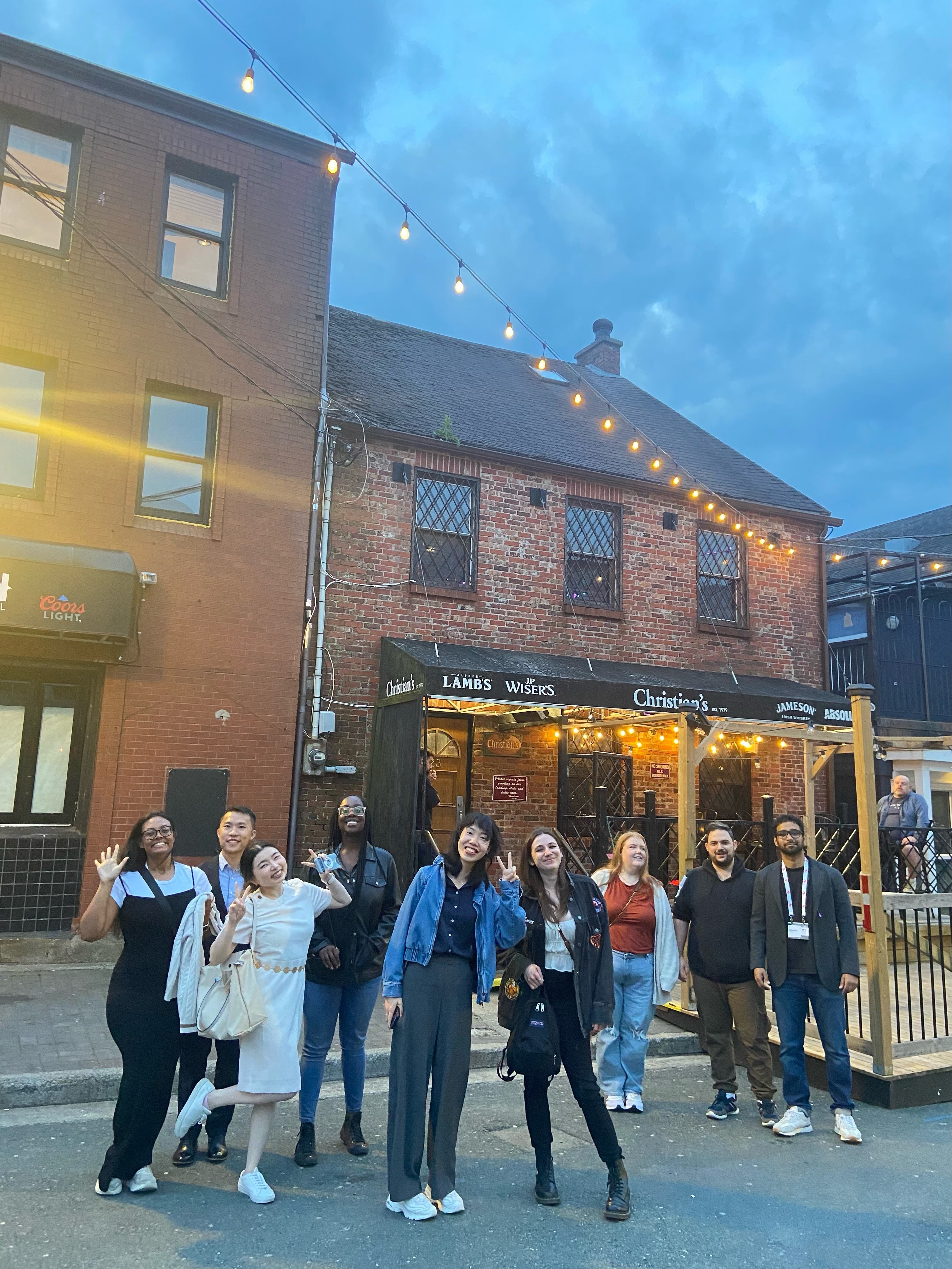 Students standing together outside restaurant