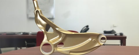 Golden lower arm made by magnesium