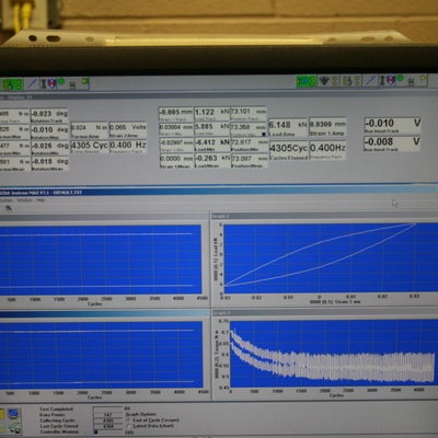Computer displaying graphs for 8874 Instron test.