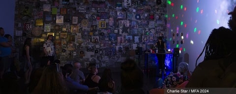 Artwork by Charlie Star. A dark room lit with multi-coloured disco lights is full of people watching a woman DJ in front of a wall that is densely packed with LP covers, posters, and ephemera.