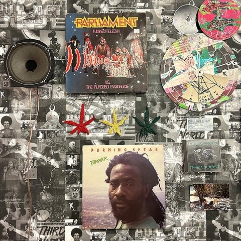 A densely packed wall featuring LP covers by Parliament and Burning Spear alongside modified discs, posters, speaker heads, ticket stubs, and ephemera.