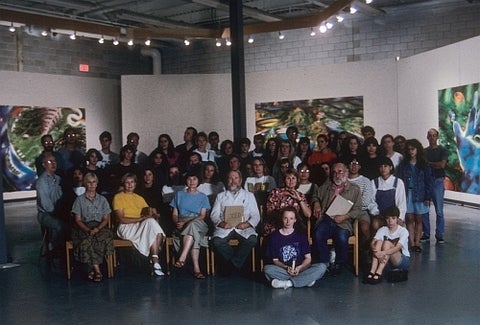 Group photo in an art gallery of the faculty and students in the 1990's