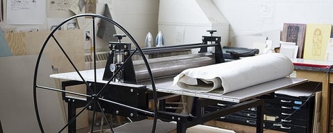 Close-up view of a printing press.