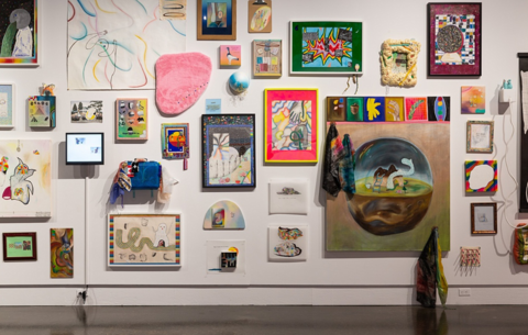 Gallery wall showcasing various artwork