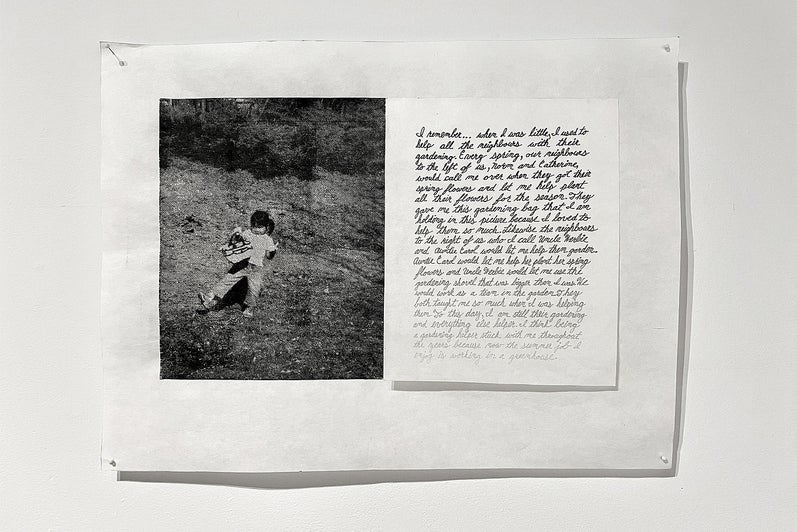 Artwork with a black and white photo of a chid carrying a tote bag and a handwritten note with ink fading from black to barely v