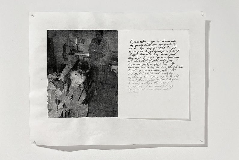 Artwork with a black and white photo of a chid using a drill and a handwritten note with ink fading from black to barely visible