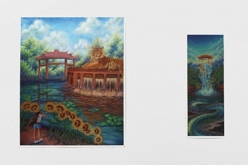 2 paintings on a wall. Fantastical landscapes, a figure watches a tiger on water dam, carp spring up in front of a Chinese gate
