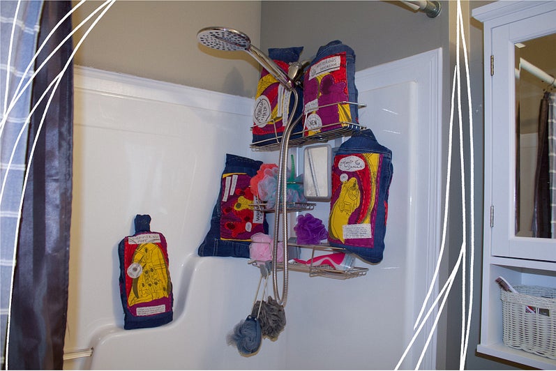 Bathroom shower with five shampoo bottles replaced by stuffed fabric sculptures with colourful appliqued images.