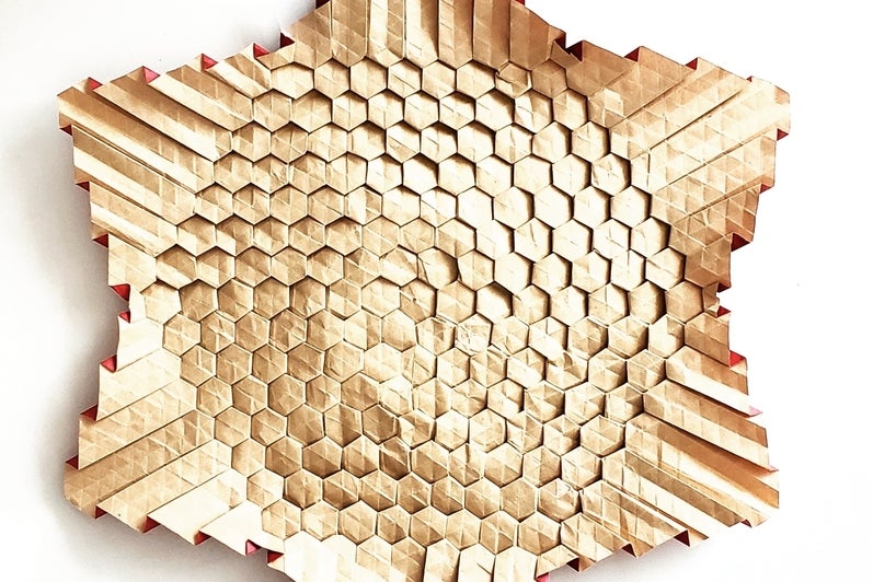 Cream coloured six pointed star with textured surface.