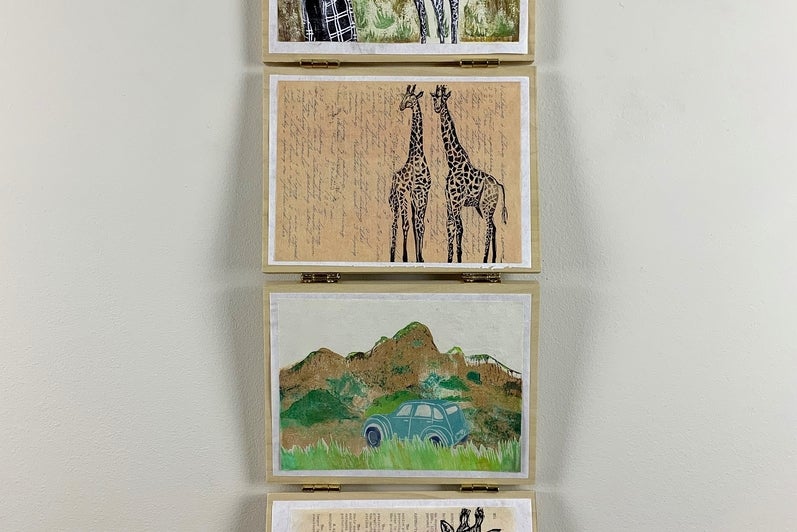 Series of four artworks hanging vertically on hinged panels. Works show a figure with a giraffe, two giraffes, text, landscape 