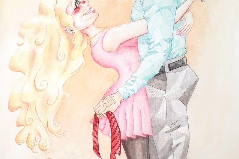 Woman holding scissors embraces man holding cut necktie