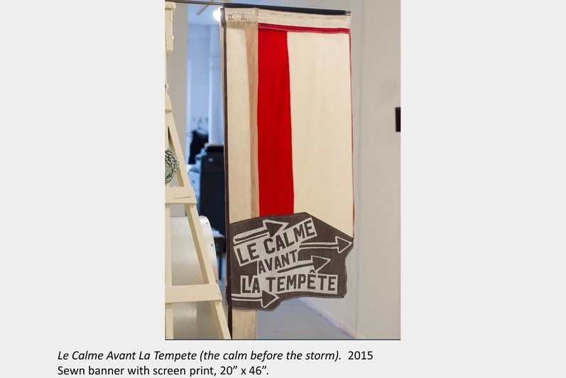Artwork by Tara Cooper. Le Calme Avant La Tempete (the calm before the storm). 2015, Sewn banner with screen print, 20” x 46”.