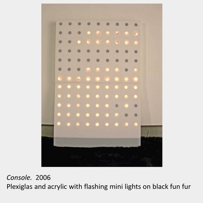 Artwork by Greg Blunt. Console. 2006. Plexiglas and acrylic with flashing mini lights on black fun fur.