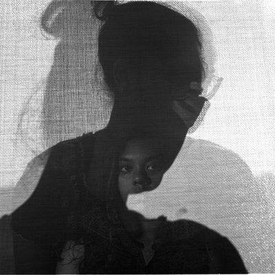 Artwork of a triple exposure of portraits which gives an effect of shadows on canvas.