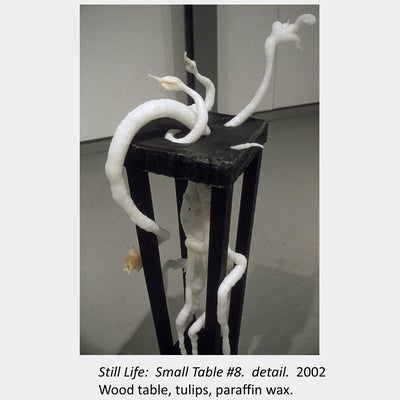 Artwork by Tamara Izsak. Still Life: Small Table #8. detail. 2002. Wood table, tulips, paraffin wax.
