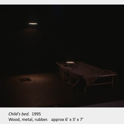 Artwork by Judith Mullett. Child's bed. 1995. Wood, metal, rubber. approx 6' x 3' x 7'