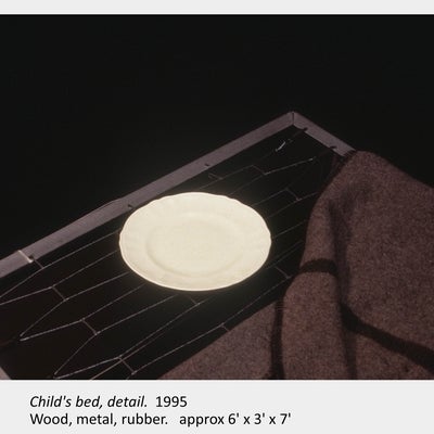 Artwork by Judith Mullett. Child's bed, detail. 1995. Wood, metal, rubber. approx 6' x 3' x 7'