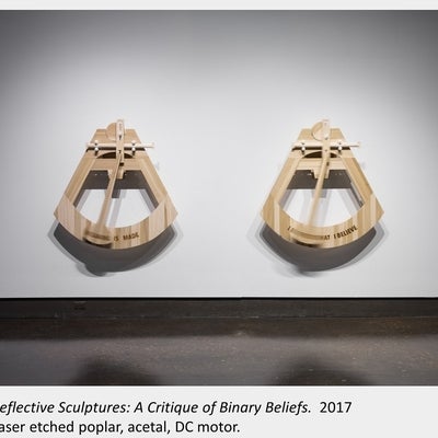 Artwork by Denise St Marie and Timothy Walker, Reflective Sculptures: A Critique of Binary Beliefs, 2017, Laser etched poplar