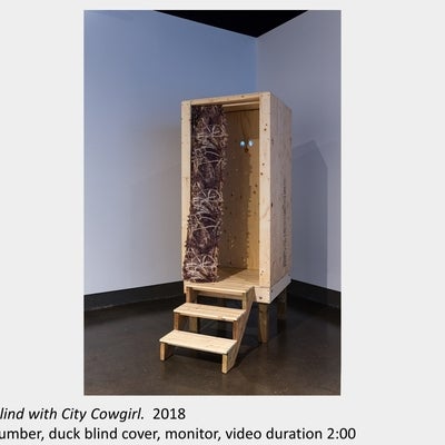 Artwork by Tait Wilman. Blind with City Cowgirl, 2018, lumber, duck blind cover, monitor, video duration 2:00