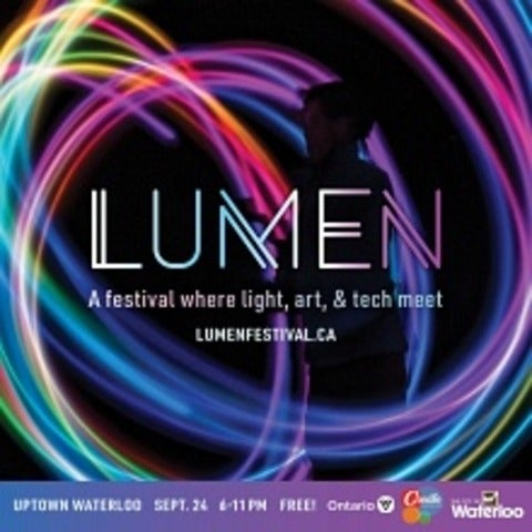 Lumen festival logo with spirals of coloured light on a black background