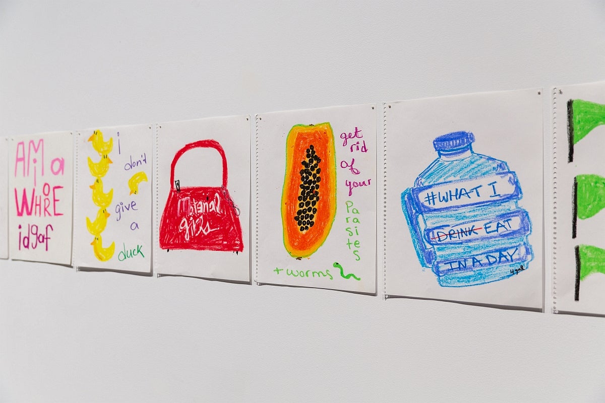 Detail showing 5 colourful drawings of everyday objects including rubber duckies, a purse, a water bottle all with added text.