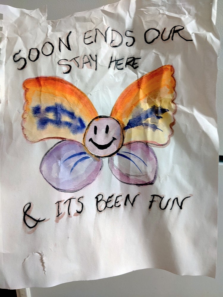 Crumpled watercolour painting of a smiling butterfly with the text "Soon ends our stay here & its been fun"