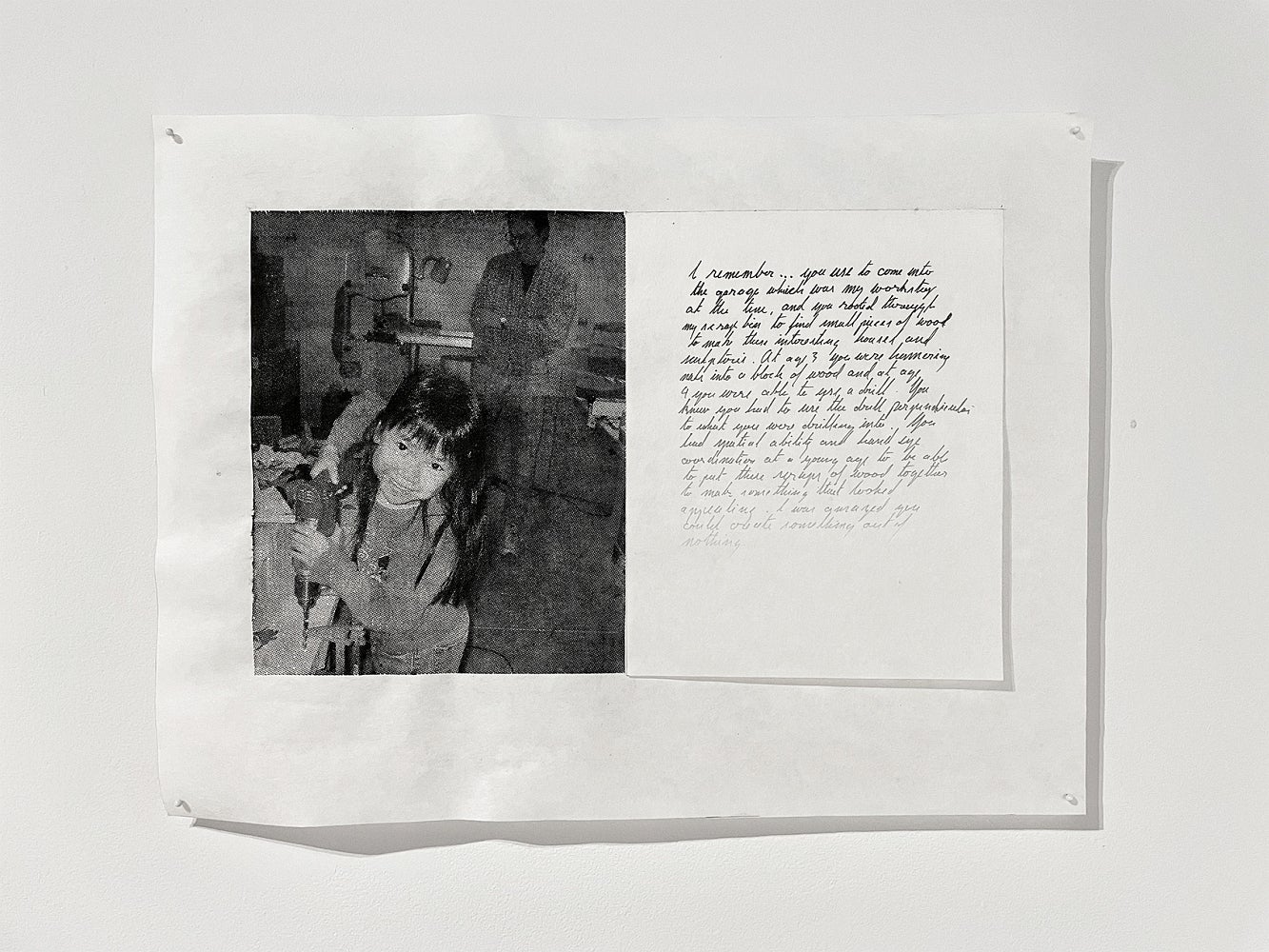 Artwork with a black and white photo of a chid using a drill and a handwritten note with ink fading from black to barely visible