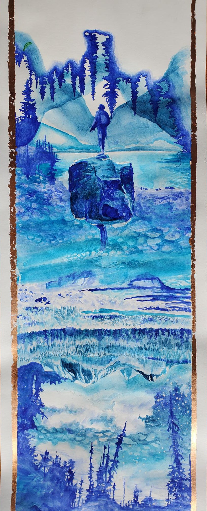 Artwork in shades of blue, landscape with cascading patterns of trees, mountains and water; a figure stands on a rock facing awa