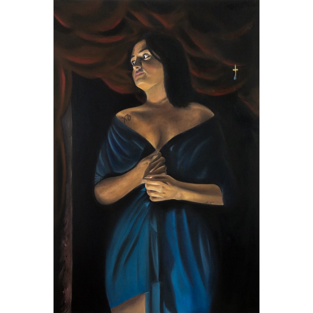A figure in a dark space looks to the right while holding closed a blue garment draped across their shoulders.