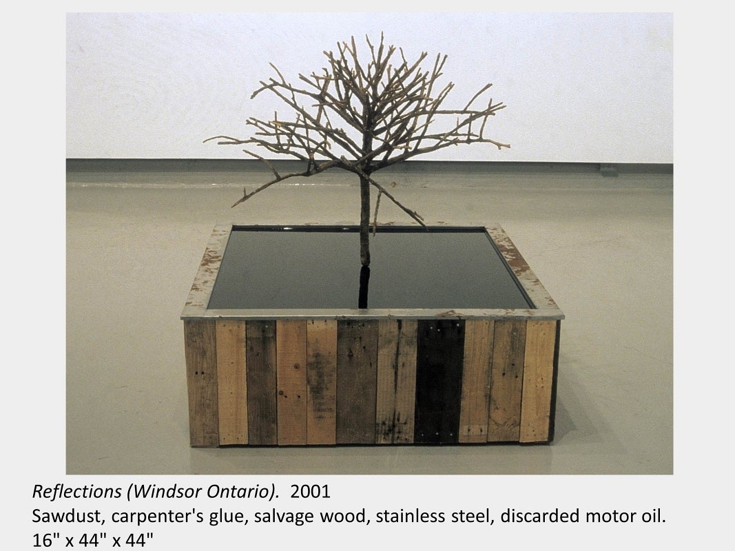Artwork by Michael Ambedian. Reflections (Windsor Ontario). 2001. Sawdust, carpenter's glue, discarded motor oil.