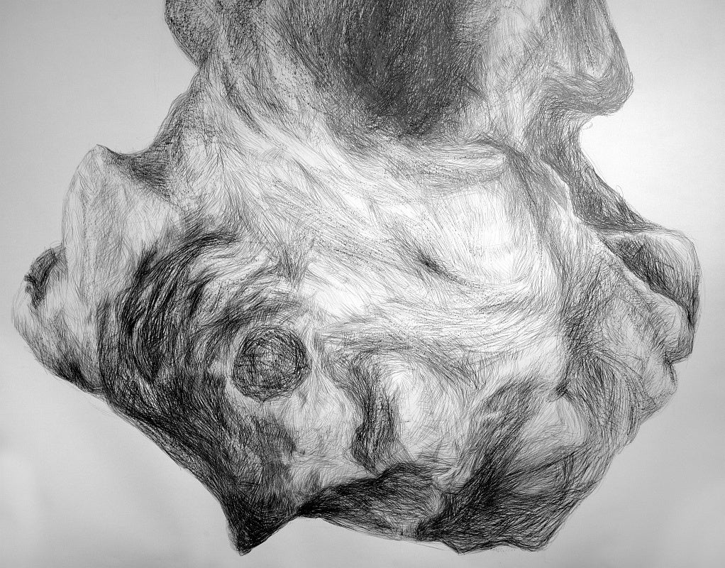 Detail view of a large pencil drawing of a rock-like shape.