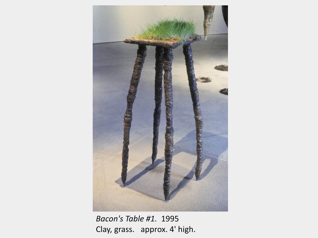 Artwork by Carol Bradley. Bacon's Table #1. 1995. Clay, grass. approx. 4' high.