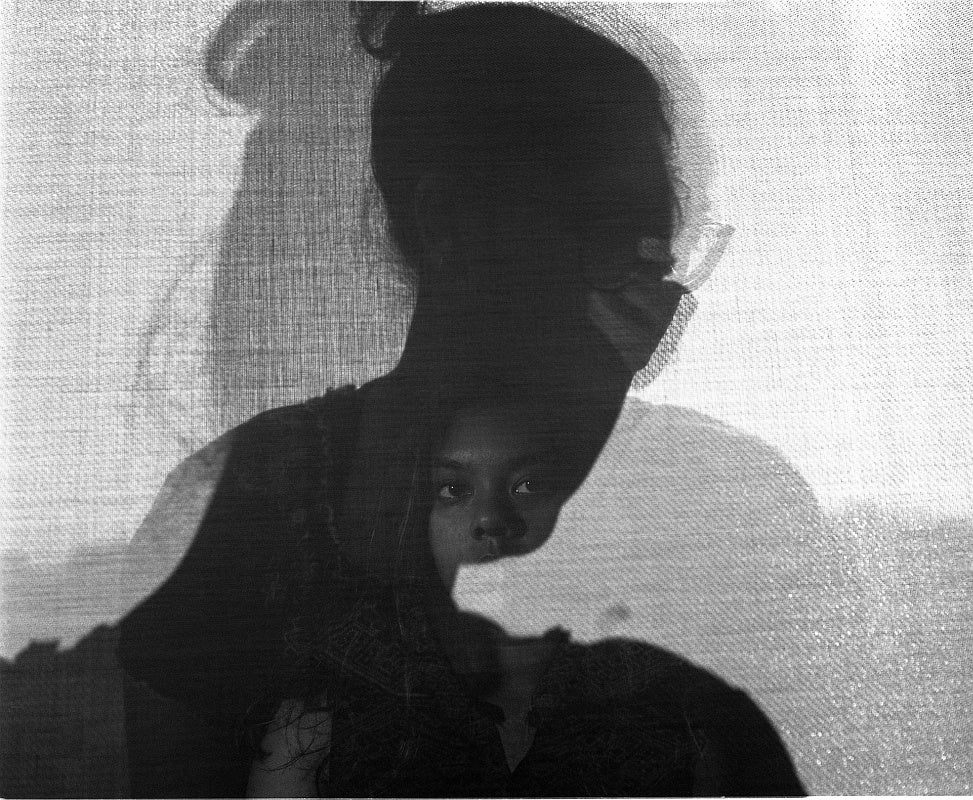 Artwork of a triple exposure of portraits which gives an effect of shadows on canvas.