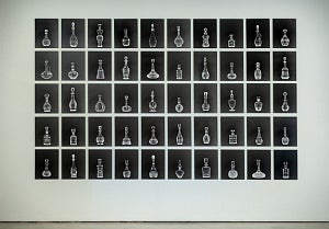 Artwork of series of black and white photographs of glassware displayed in gird pattern of 10 x 5