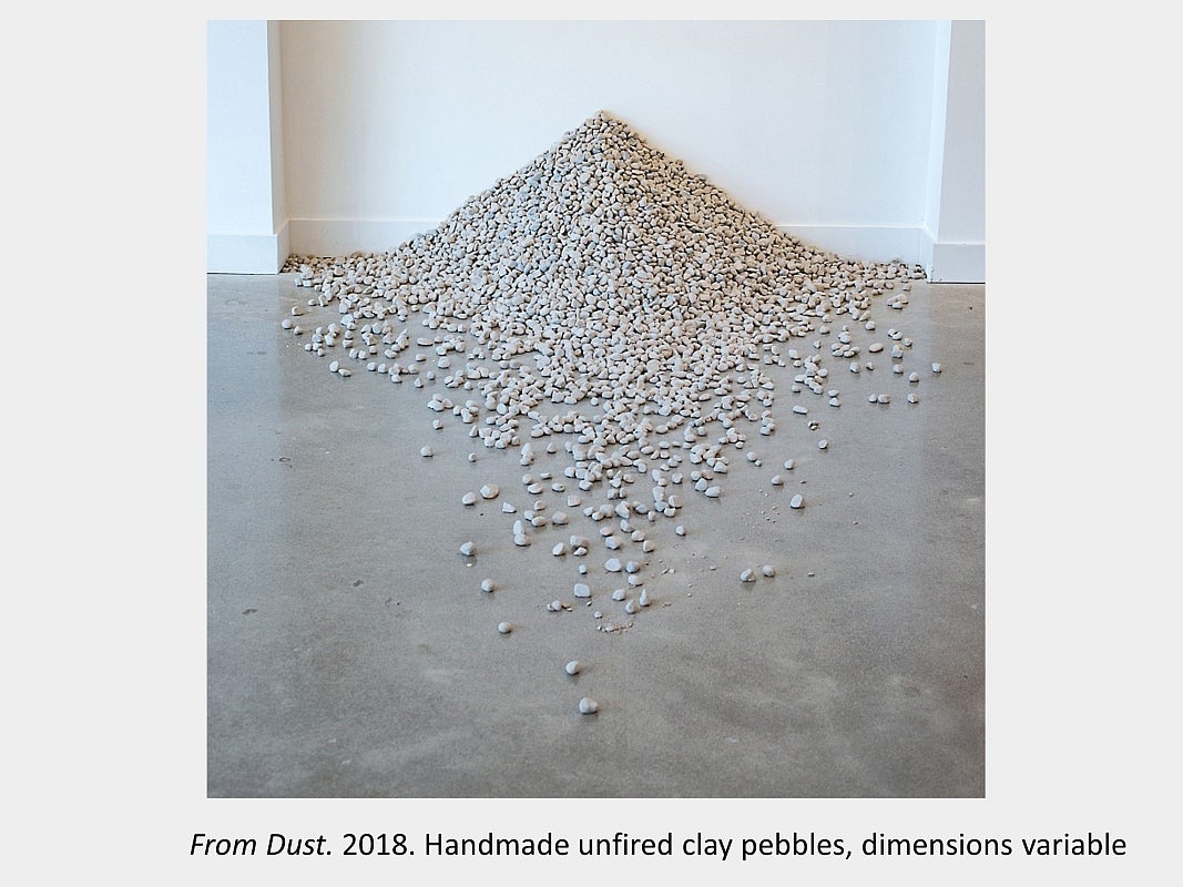 Artwork by Sara Pearson - From Dust. 2018. Handmade unfired clay pebbles, dimensions variable