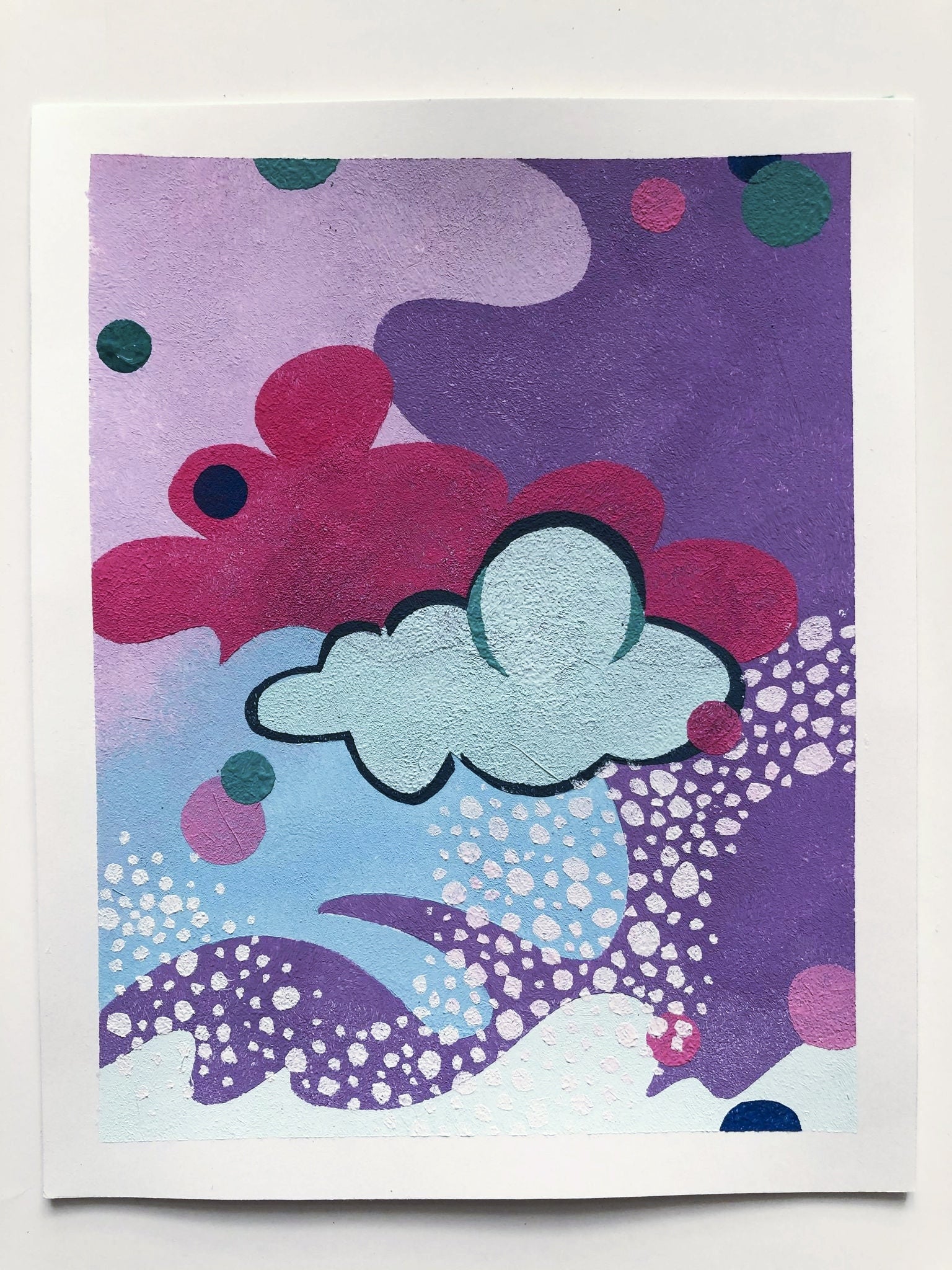 Textured abstract design of cloud-like shapes in shades of purple and blue.