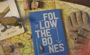 Book cover titled Follow the Bones with a map, work gloves and a dinosaur figurine