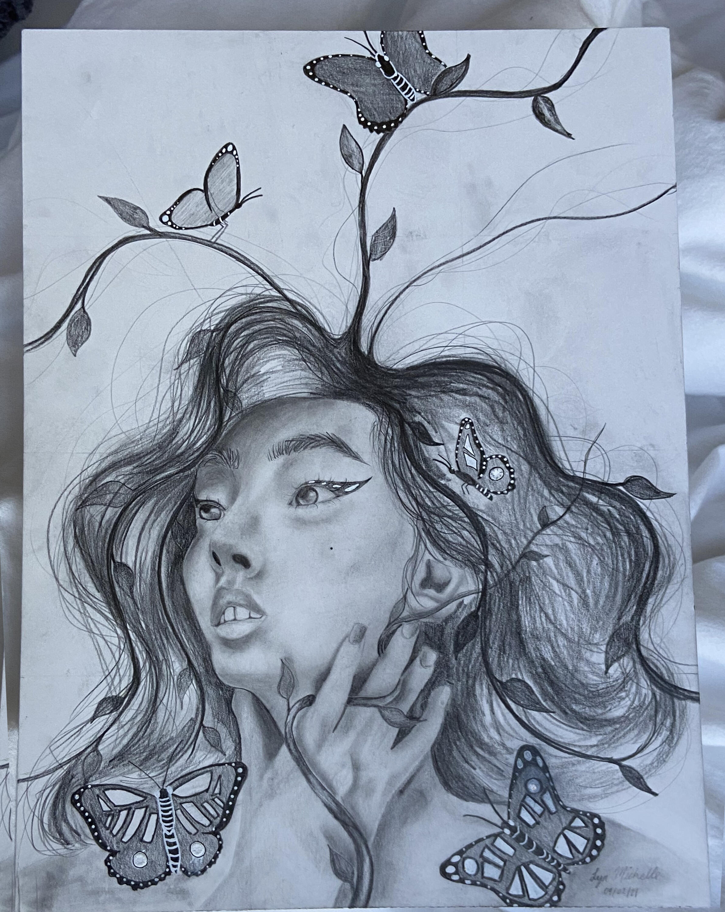 Artwork of a head with long hair morphing into vines.  Butterflies surround the person.