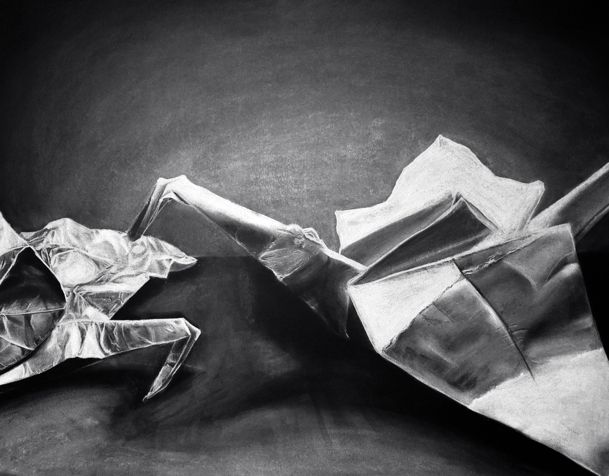 Black and white drawing of origami birds on a table.