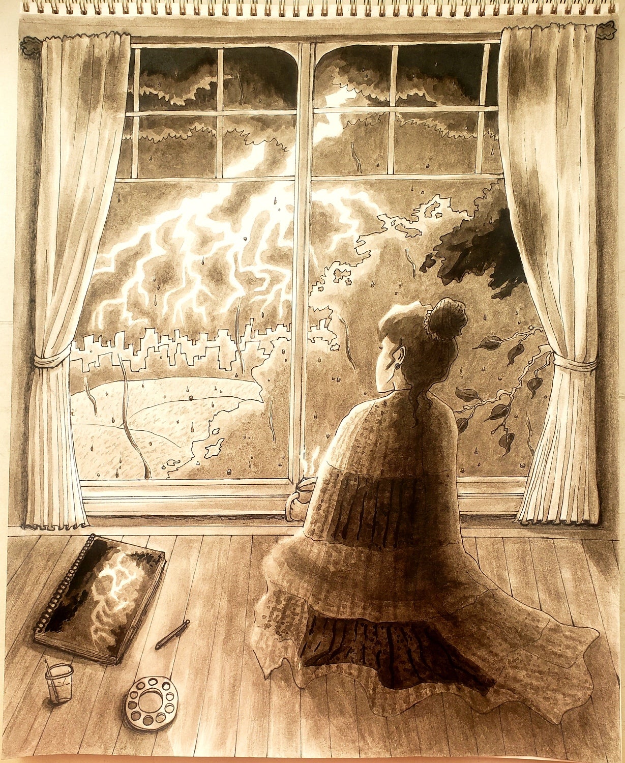 Person sits by a window watching lightning with a painting of lightning beside them.