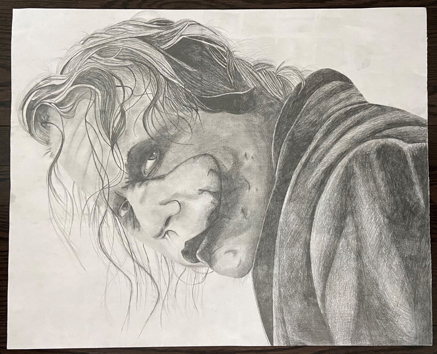 Black and white portrait drawing of the Joker