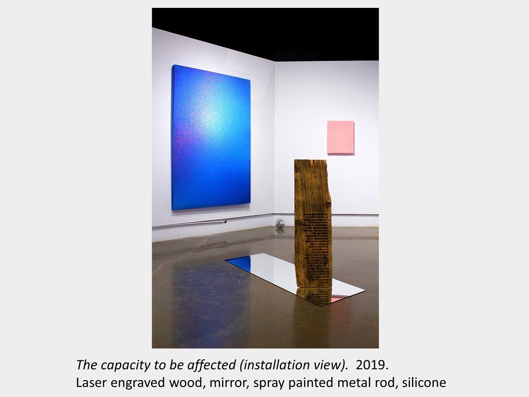 Tyler Matheson's artwork "The capacity to be affected" 2019, laser engraved wood, mirror, spray painted metal rod, silicone